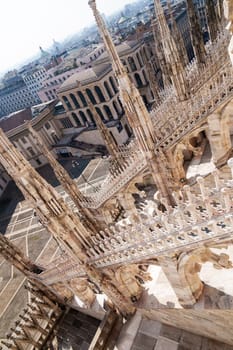 Milan, Italy - 19.03.2024: Architectural detail and skyline view from the roof of Milan Duomo Cathedral.
