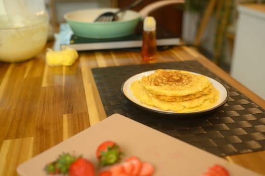 Close up of delicious pancakes on a kitchen table ready for breakfast.