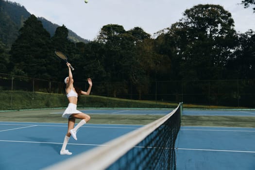 A joyful female tennis player dressed in white, striking a dynamic pose on the court, surrounded by lush greenery and blue skies Perfect for summer sports themes