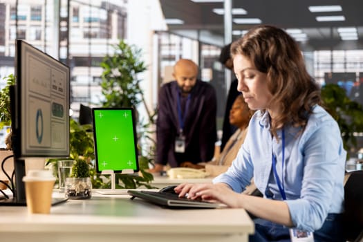 Female advisor conducting financial planning and goal setting with a mockup, demonstrating expertise in budget management. CEO analyzing online reports and forecasts for company growth.