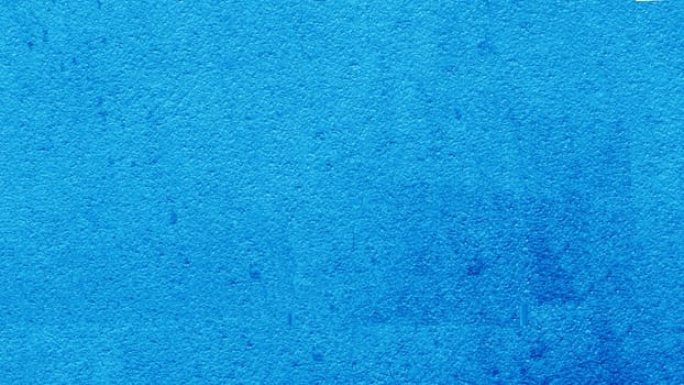 Surface of a blue painted concrete wall. Grunge blue wall texture.