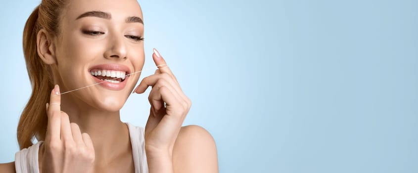 Dental Health Care. Woman Using Dental Floss Over Blue Background, Panorama with Free Space