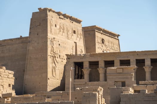 Side view of the reconstructed Philae Temple on an island in Aswan Harbor or Reservoir formed by the Low Dam on the Nile