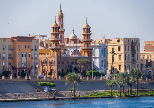 Large and ornate Mosque on waterfront in Esna