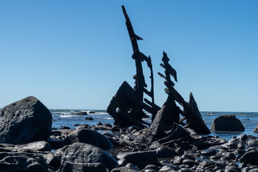 Shipwrecked remains of bow of Gairloch on south end Oakura beach New Plymouth.