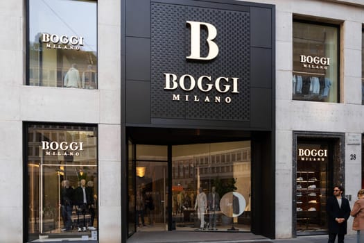 Milan, Italy - April, 08, 2025: BOGGI MILANO storefront exterior with mannequins and logo signage. Italian menswear fashion boutique, street view.