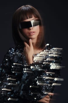 Sequin dress, sunglasses, woman, smiling a woman in a sequin dress with sunglasses on her head, smiling at the camera with her hand on her chin