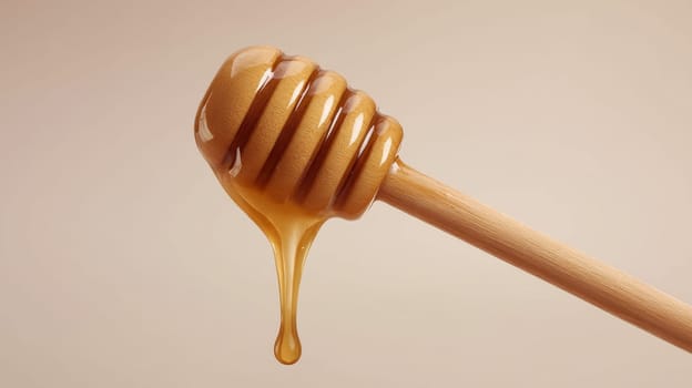 Honey dipper with dripping golden honey on a beige background, representing sweetness.