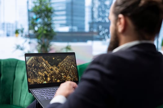 Bucharest, Romania - July 30th 2024 - A businessman relaxing with Netflix in his personal office, streaming a movie and taking a break from work. Young CEO with a global business.