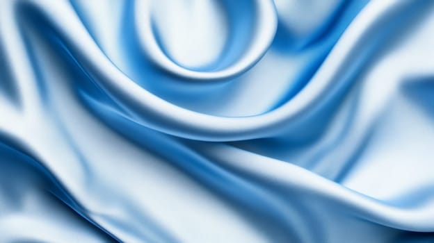 Luxurious light blue silk fabric with elegant flowing folds, abstract texture.