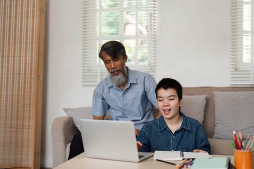 A delightful interaction between a grandfather and grandson as they enjoy an online activity together, showcasing the strength of family bonds through shared experiences.
