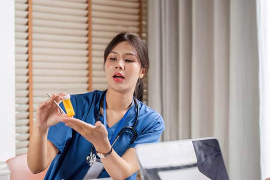 A doctor explaining medication options using a prescription bottle during a consultation, fostering clear communication and patient understanding.