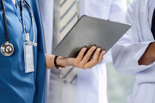 A healthcare professional using a tablet to access patient records, improving the consultation process.