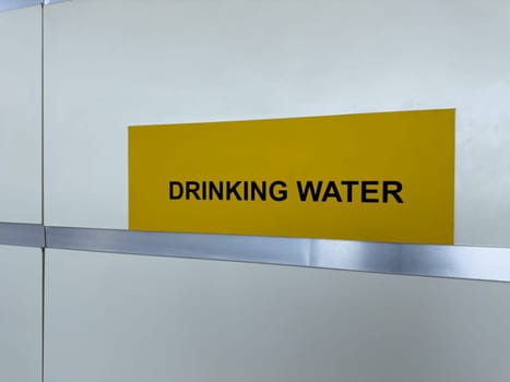 Drinking water sign in a public space promotes hydration, health awareness, and easy access to clean water for all visitors in a safe and modern environment