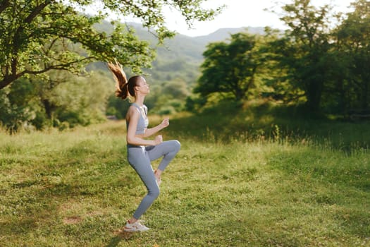 Energetic young woman in blue activewear jogging through a vibrant green landscape, expressing joy and determination Perfect for fitness, healthy lifestyle themes