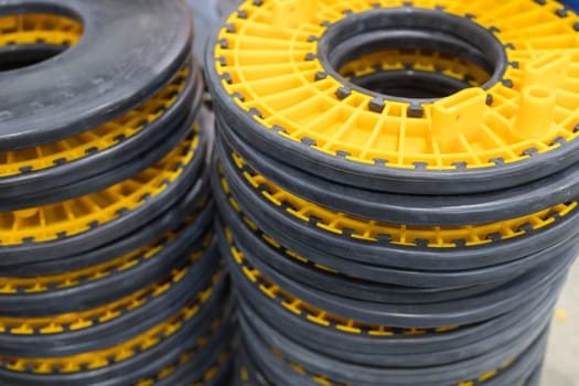 Close-up of stacked industrial plastic components, showcasing precision and manufacturing processes