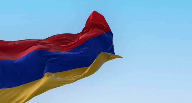 The national flag of Armenia waving in the wind on a clear day. Three horizontal bands in red, blue and apricot. 3d illustration render. Rippled textile