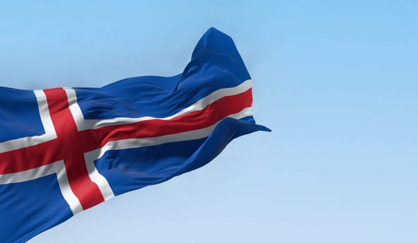 Close-up view of the Iceland national flag waving in the wind. Blue flag with a white-edged red Nordic cross. 3d illustration render. Fluttering fabric.