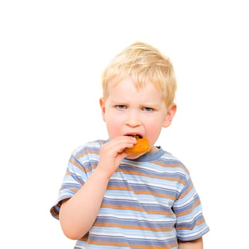 Cute little boy eating delicious cookie isolated on white background