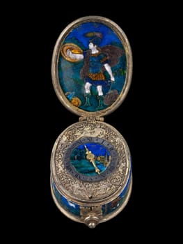 Intricately enameled silver watch by Suzanne de Court, dating to the first quarter of the 17th century. Features detailed miniature paintings and ornate metalwork. A glimpse into early horology and Renaissance artistry.