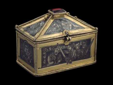 British reliquary casket, circa 1173-80, depicting the martyrdom of Saint Thomas Becket. Features detailed metalwork with silver and gold tones, and narrative scenes. Represents medieval religious art and historical significance.