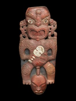 Powerful 1820s Maori Tekoteko gable figure from the Te Arawa tribe. Carved wood with intricate patterns and shell inlay. Represents ancestral power and cultural heritage.