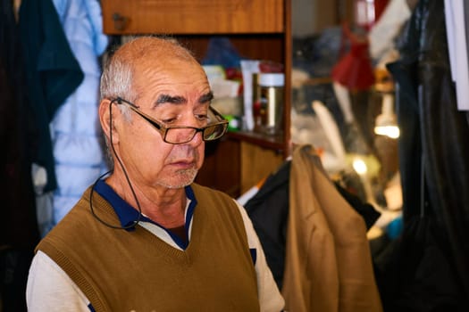 a person whose occupation is making fitted clothes such as suits, pants, and jackets to fit individual customers.