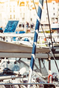 Yacht marina with sailboat masts and solar panel background, 