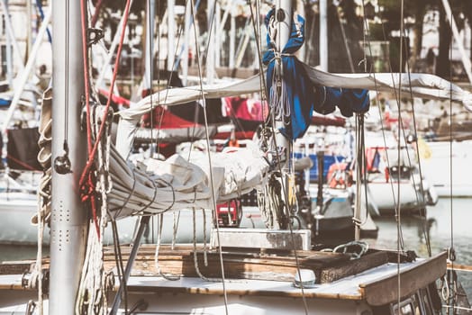 Sailboats in harbor with coiled ropes and nautical details, background, 