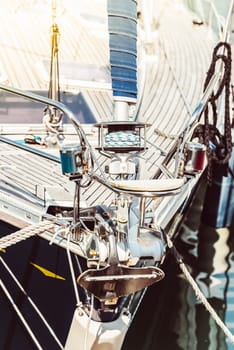 Sailboat deck close-up with ropes and metal fixtures, nautical concept background, 