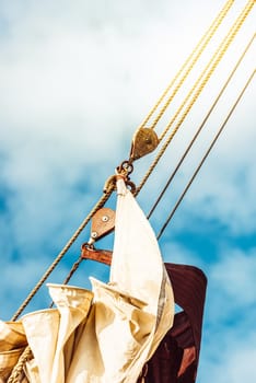 Sailboat rigging against clear blue sky, showcasing nautical elements, 