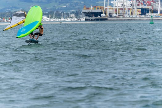 Tauranga New Zealand - March 8 2023; Wingfoiling action across Pilot Bay in GWA tour event