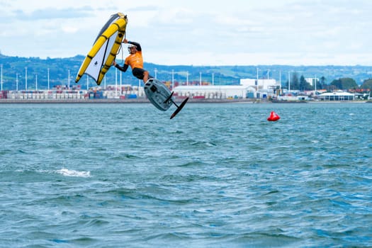 Tauranga New Zealand - March 8 2023; Wingfoiling action across Pilot Bay in GWA tour event