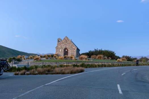 Historic Church of Good Sheppard famous tourist destination on shore of Lake Tekapo at twilight in New Zealand.
