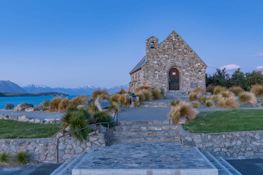 Historic Church of Good Sheppard famous tourist destination on shore of Lake Tekapo at twilight in New Zealand.