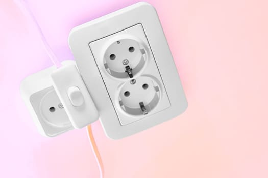 able to be connected by means of a plug. an electrical device receiving a plug or light bulb to make a connection