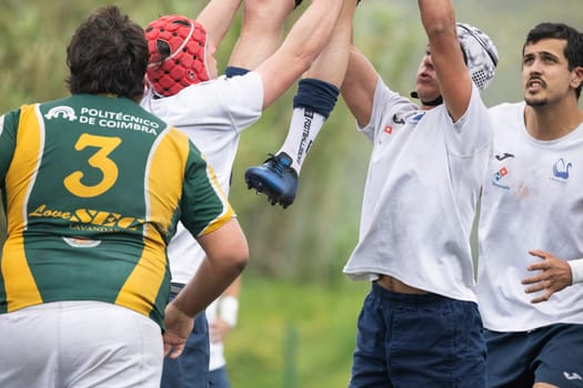 3 may 2025, lisbon. Portugal - oeiras vs ag - rugby players jumping and lifting teammate during line-out in a rugby game