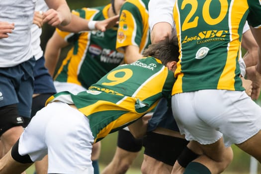 3 may 2025, lisbon. Portugal - oeiras vs ag - rugby players wearing uniforms tackling during a game