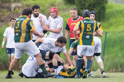 3 may 2025, lisbon. Portugal - oeiras vs ag - rugby players competing for the ball during a rugby match on a green field