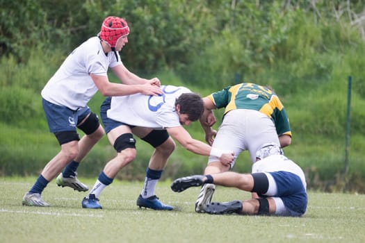 3 may 2025, lisbon. Portugal - oeiras vs ag - rugby players tackling and competing for the ball during a rugby match