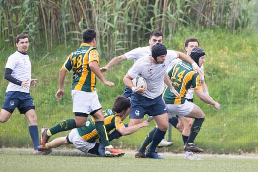3 may 2025, lisbon. Portugal - oeiras vs ag - rugby players running with the ball and tackling during a rugby game