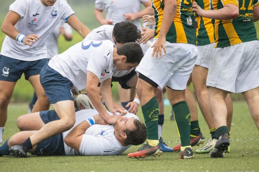 3 may 2025, lisbon. Portugal - oeiras vs ag - rugby players competing intensely, tackling an opponent on the field during a professional game