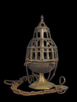 Ornate 16th-century censer from the South Netherlands. Crafted from metal with an openwork cage design, chains, and a base. Represents historical religious or ceremonial objects.