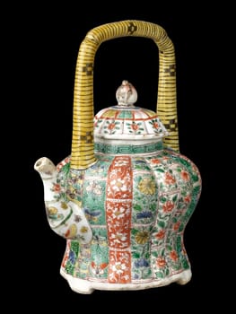 Elaborately decorated antique Chinese covered teapot from the Qing Dynasty. Features intricate floral and figural designs in vibrant green, red, and white on porcelain.