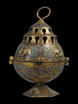 Detailed bronze censer from 13th century France, featuring intricate patterns and a tiered design. Reflects medieval craftsmanship and religious practices.