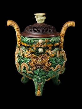 Detailed green and gold glazed ceramic censer from 1512 China. Features intricate carvings and a rich texture, reflecting ancient craftsmanship and spiritual tradition.