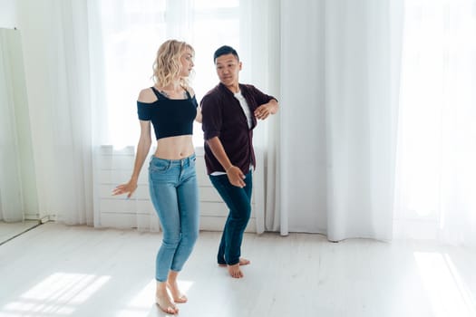 Man and woman dancing together to bachata music