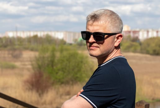 Attractive mid aged man posing for photo