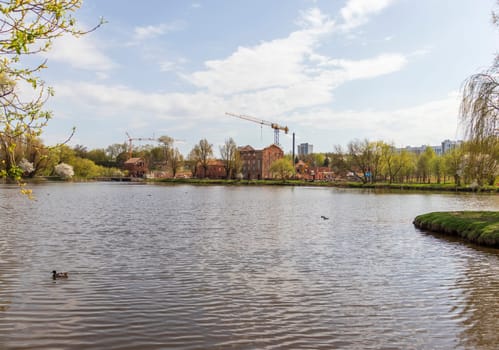 Construction cranes on site of restoration of the catholic church
