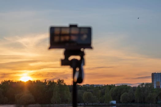Cell phone on the tripod capturing sun set moment